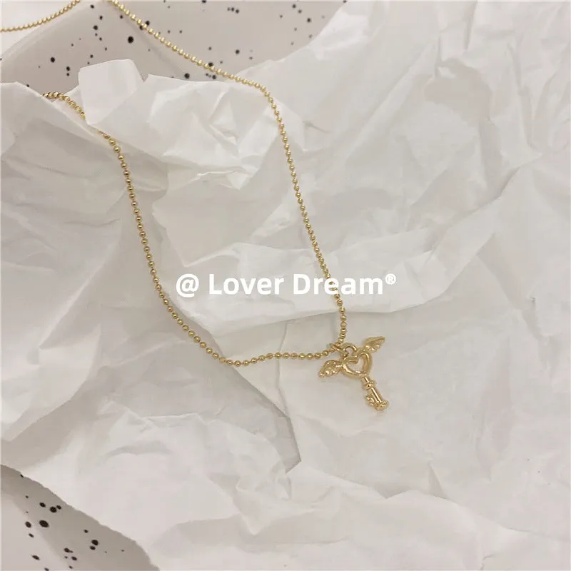 Gold-Plated Key Pendant Necklace with Wing Accents – Dainty and Symbolic Jewelry-jltn0513