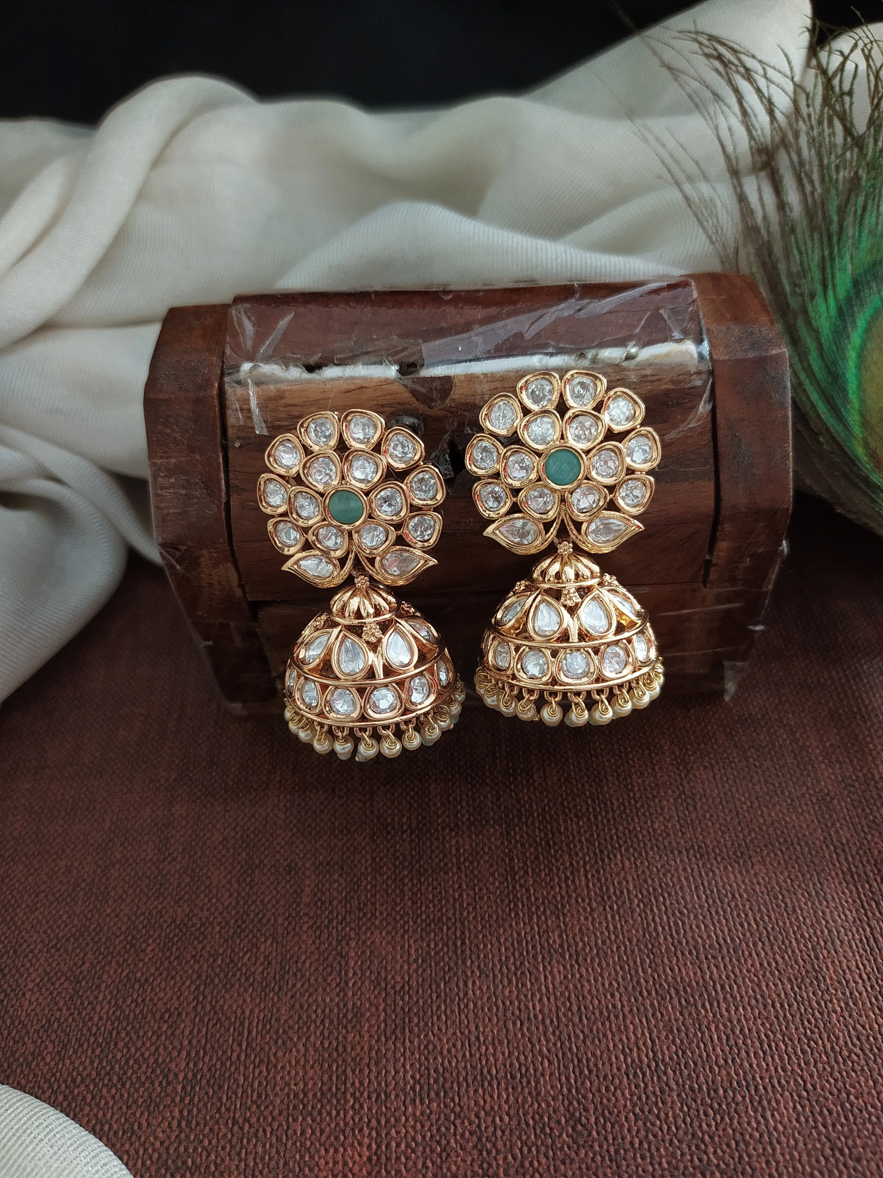 "Kundan Floral Studded Jhumki with Mint Center and Pearl Drops"